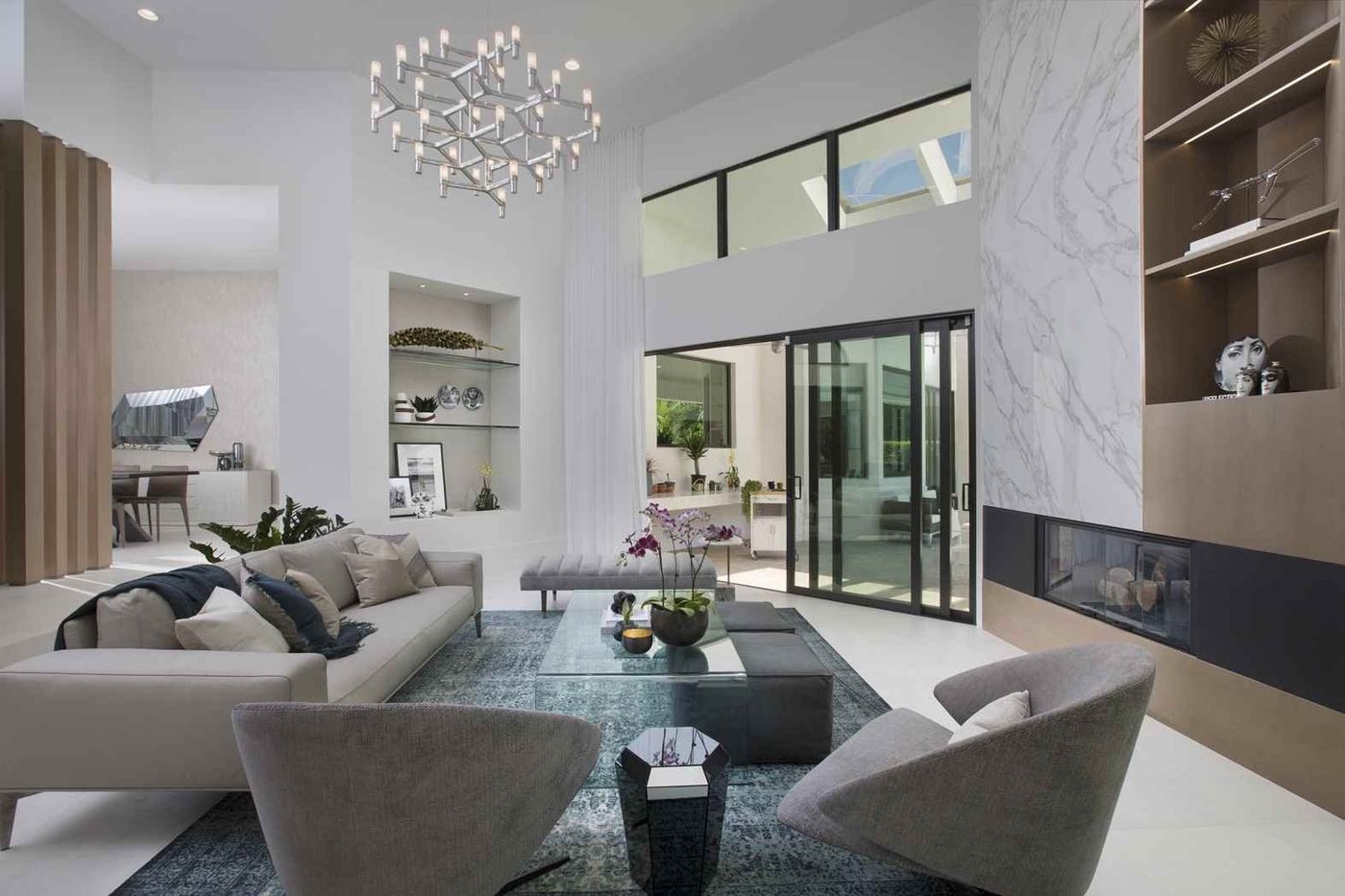 Luxury living room with designer finishes and marble accent wall